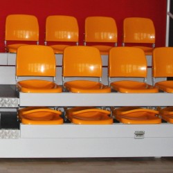 Plastic seats for tribune SP-38 with folding backrest, mounted to the step