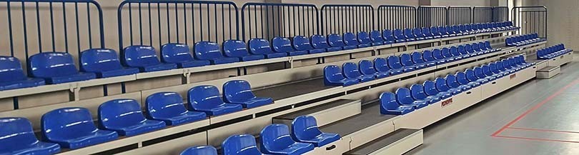 Telescopic tribunes for indoor facilities