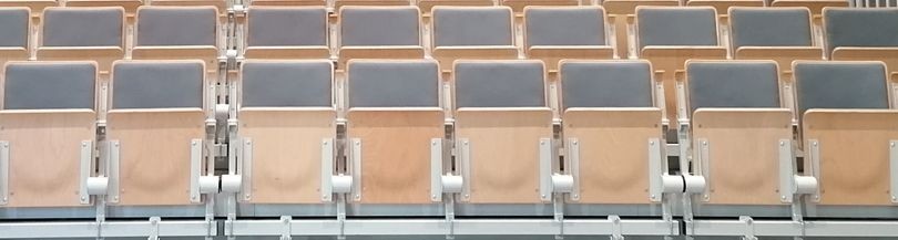 Spring-folded auditorium seats