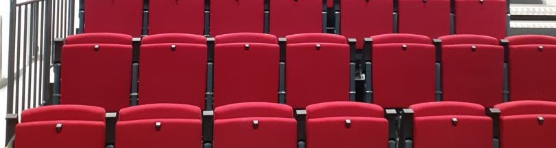Auditorium seats folded by gravity